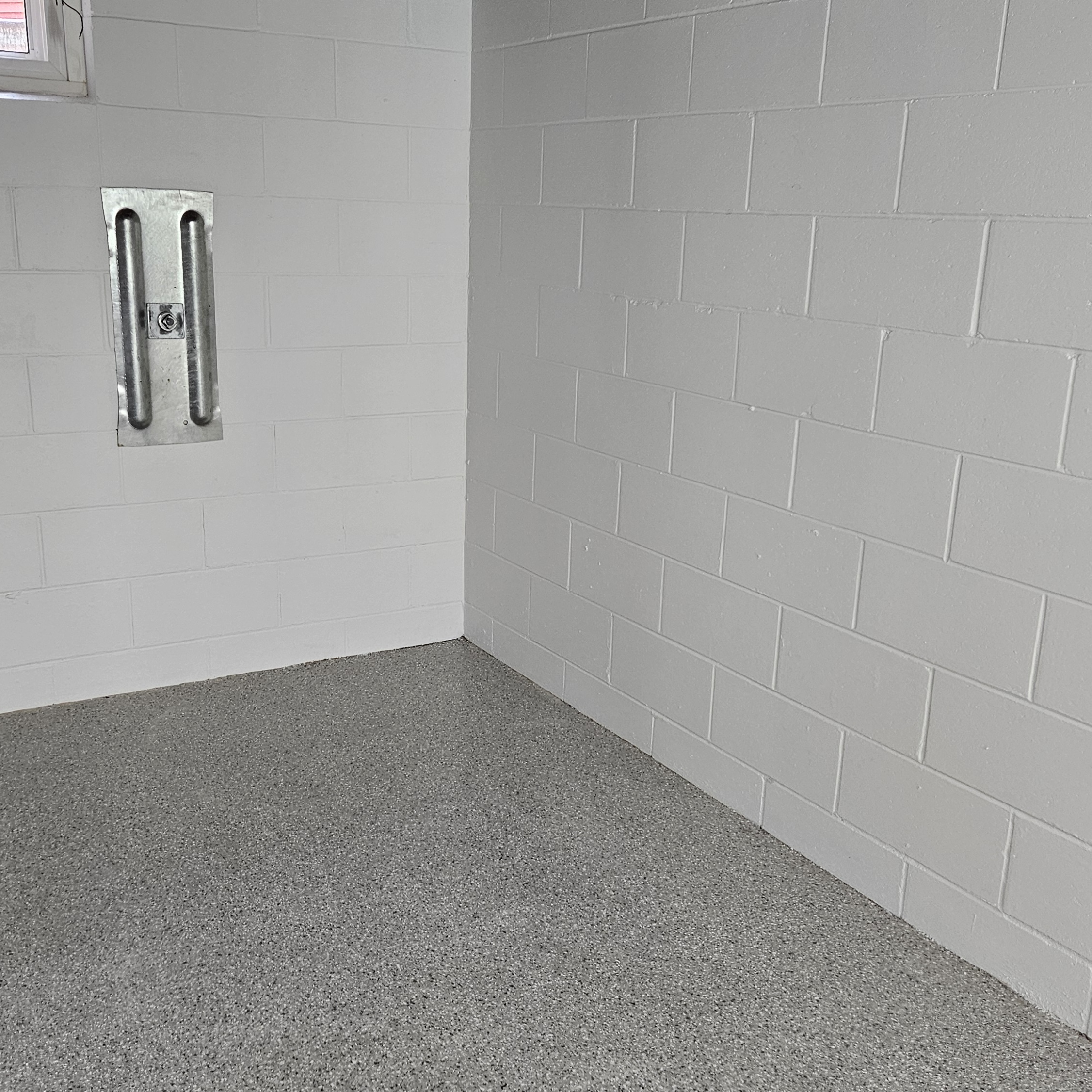 Basement photo after painting a fresh coat of white paint